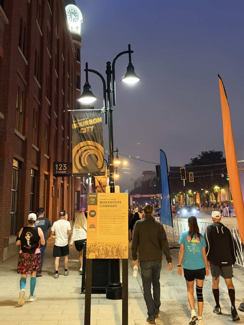 Walking over to the start of the Kentucky Derby Festival Marathon with other runners.
