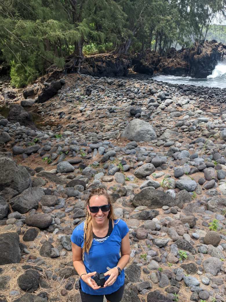 Erin on a rocky coast at Laupahoehoe.