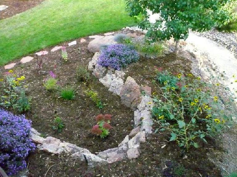 [After] Most of the perennials to the right of the deck stayed in bloom even in September.