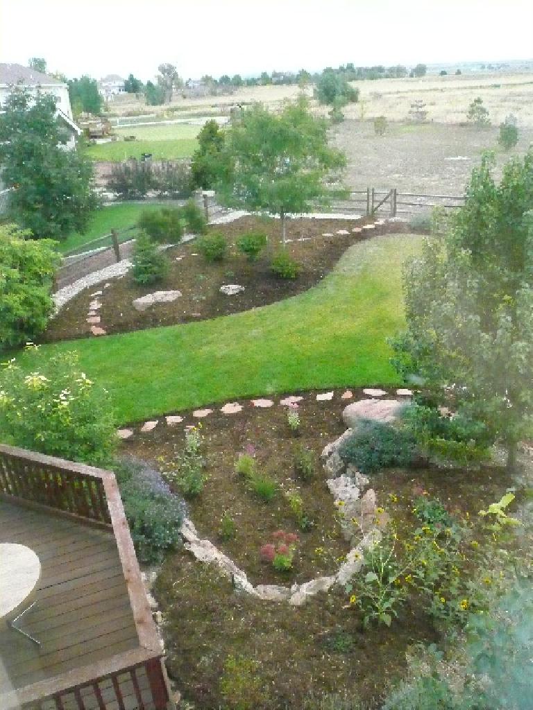 [After] Overhead view of the back yard, with flagstone and many more perennials.  May install more shrubs and perennials by the rear fence next year.