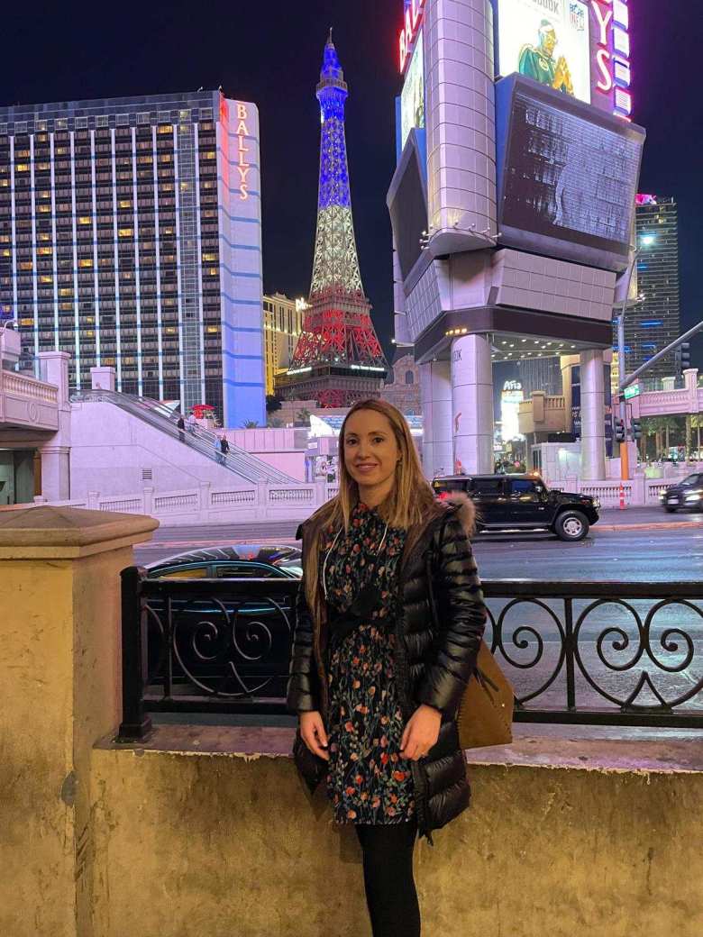 Andrea with the blue, white and red Eiffel Tower of Las Vegas behind.
