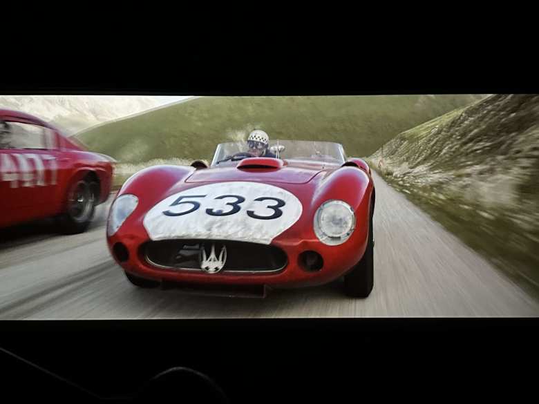 A red Maserati race car in the Ferrari movie.