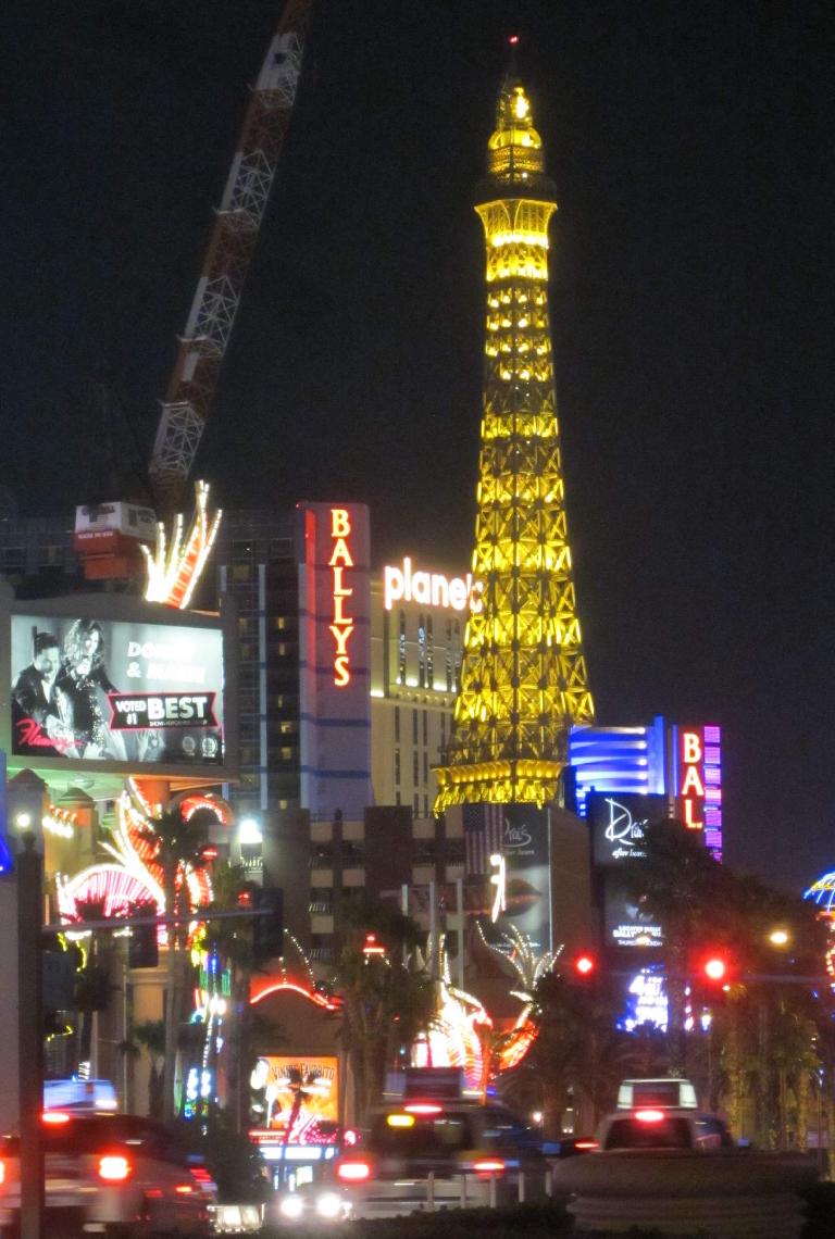 The faux Eiffel Tower in the Strip at night.