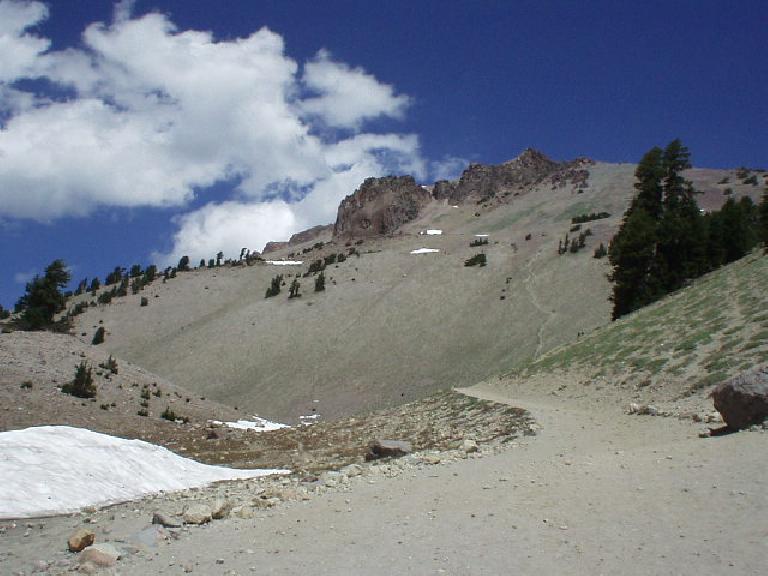 Lassen Peak is the highest peak in Shasta County, at ~10500'.  Towards the right of the photo you can see the "healing scar" which was actually a steep firetrail blazed by shortcutting hikers (now strictly prohibited).