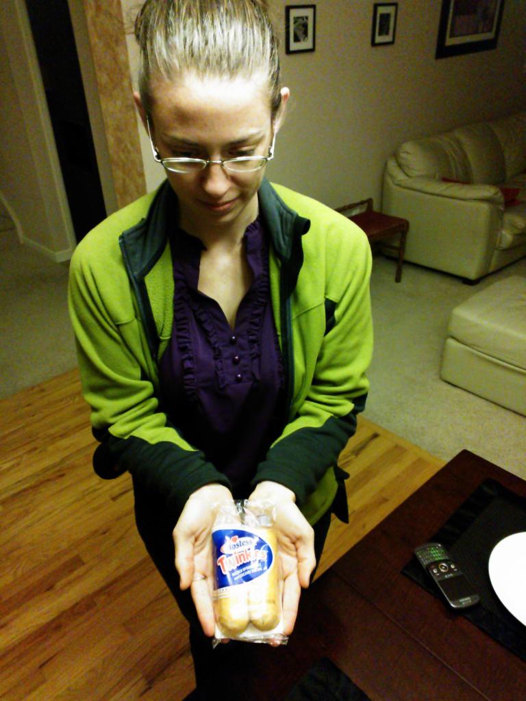 Colleen in anticipation of trying a Twinkie for the first time in her life, five days before the expiration date on the package.