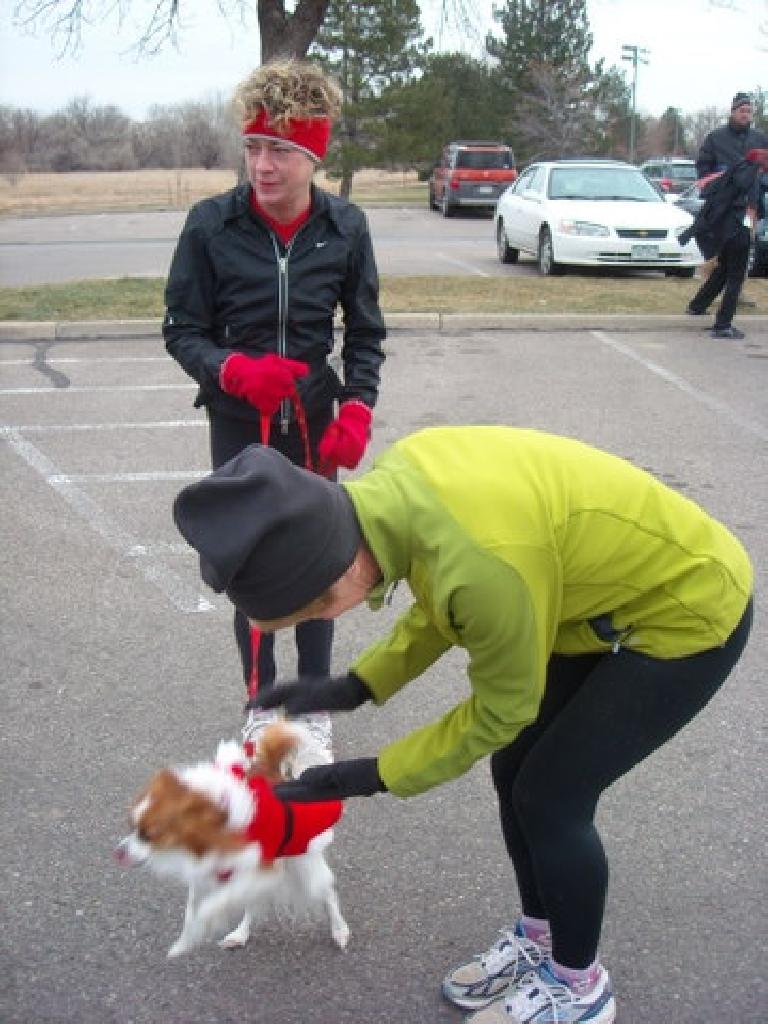 This little doggie dressed as Santa Claus ran this race.