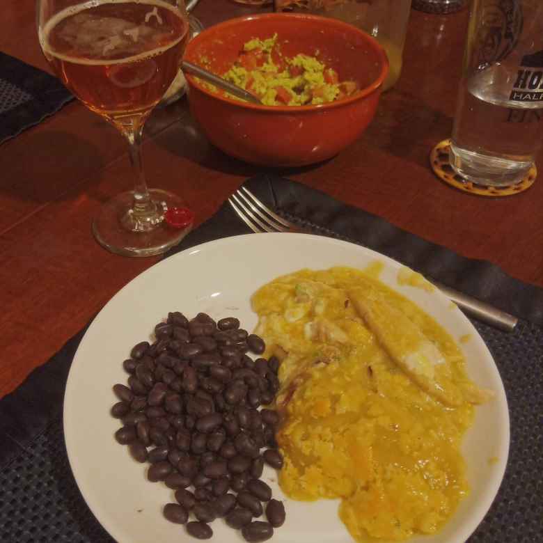 Black beans, chicken enchiladas, guacamole, and beer for dinner.