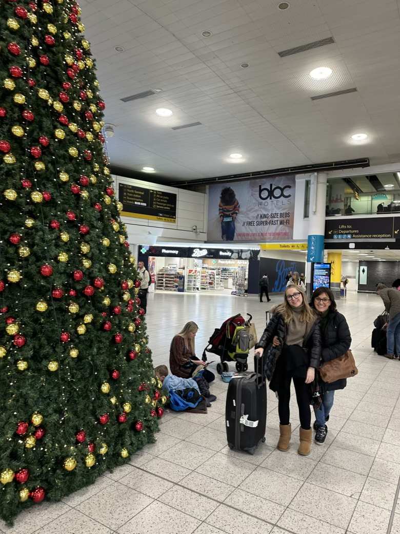 At the London-Gatwick airport with a giant Christmas tree.