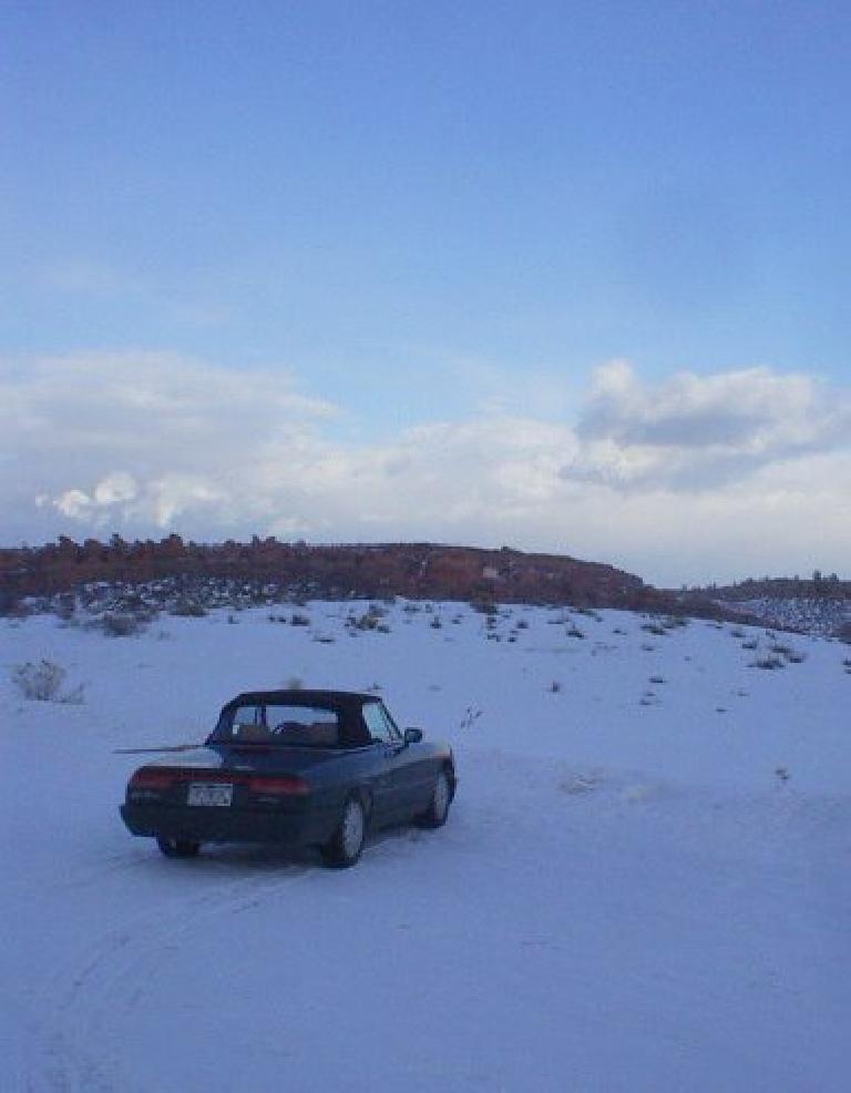 The Alfa Romeo in the winter wonderland.