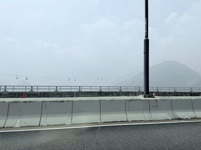 The Ngong Ping 360 cable cars stretch across a 5.7-kilometer span, transporting passengers from Tung Chung toward the peaks of Lantau Island. This 25-minute journey is widely considered one of the world's most scenic cable cars tours and offers a bird's-eye view of the South China Sea, eventually leading to the Big Buddha.