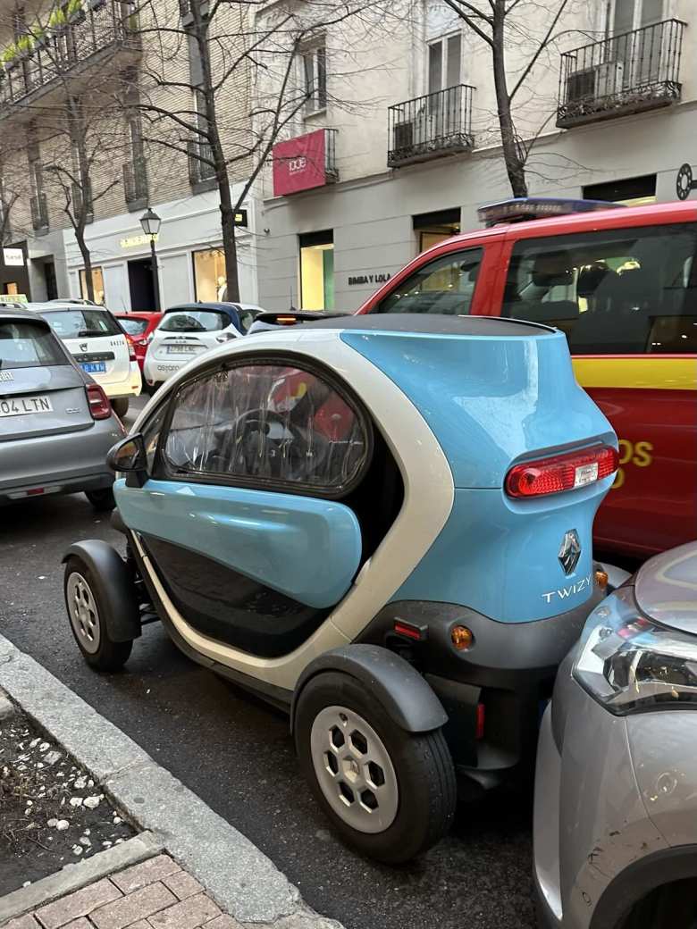 Parking can be tight in Madrid. There was plenty of space, however, for this blue Renault Twizy electric microcar.