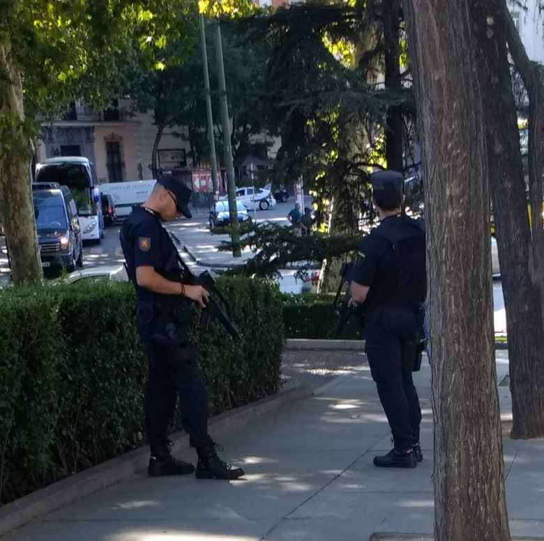 Armed policemen near the Prada Museum.