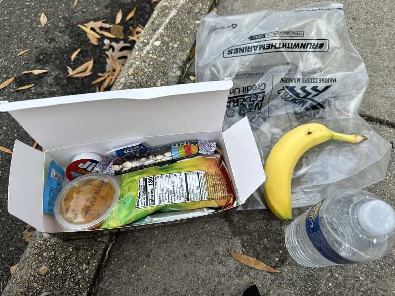 Food provided at the end of the Marine Corps Marathon included fruit, peanut butter, a Kind granola bar, veggie chips, a banana, and bottled water.