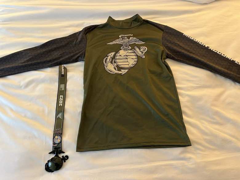 The Marine Corps marathon shirt and finisher's medal.