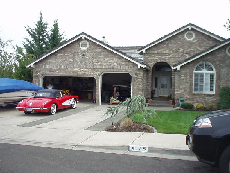 A nice home in east Medford with a vintage Vette in front.