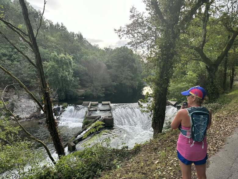 Mel looking at some waterfalls on a 12-kilometer run we did in Pontevedra by the Lérez River.
