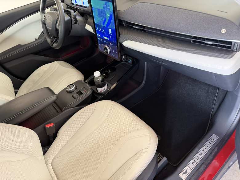 I found some inexpensive carpeted floor mats for the Mach-E that fit perfectly and utilized the stock mat mounting points.