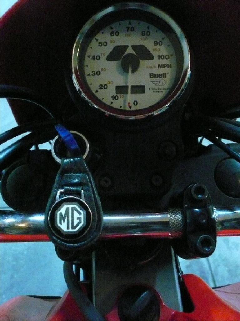 MG key fob, Buell Blast motorcycle gauge and handlebars