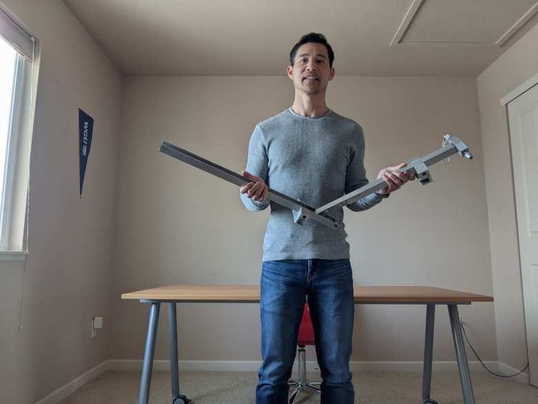 Felix Wong and the bicycle rack he designed for his 1969 MGB in 1996 at Stanford University.