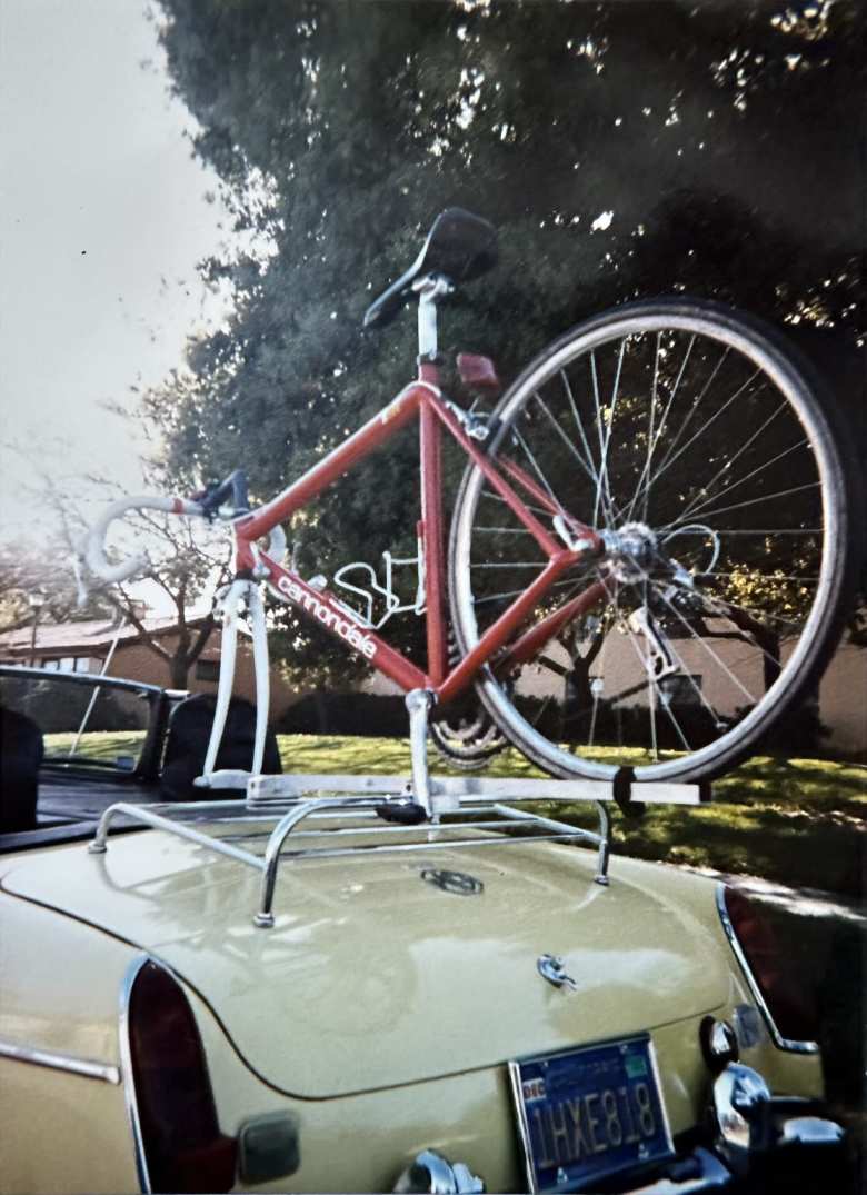 My red Cannondale R500 road bike mounted on the MGB bicycle rack I designed and manufactured in ME103 at Stanford University.