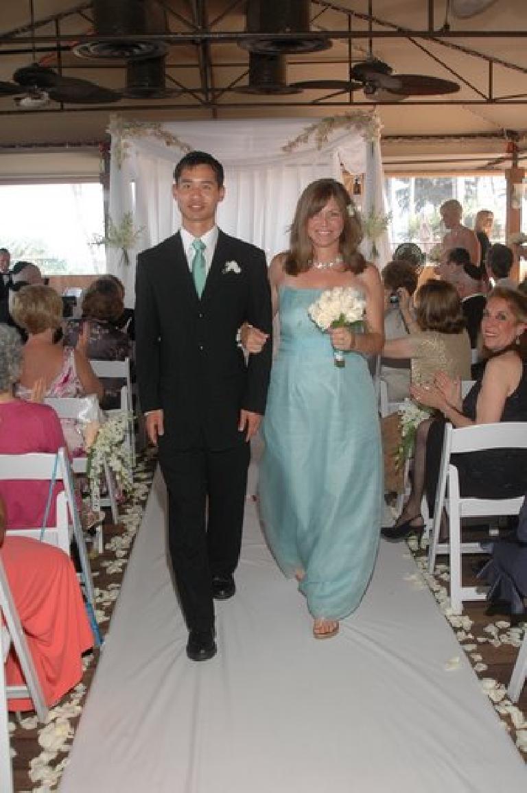 Felix Wong walking down the aisle with Patti, one of the bridesmaids.