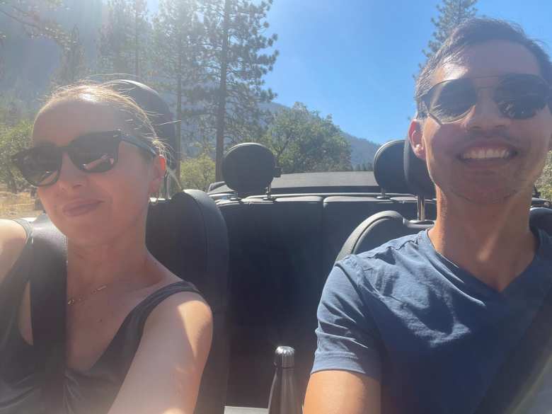 Andrea and Felix driving through Yosemite Valley with the top down.