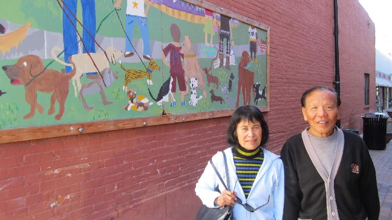 Mom and Dad in front of a doggie mural around the corner from Wagz in Old Town.