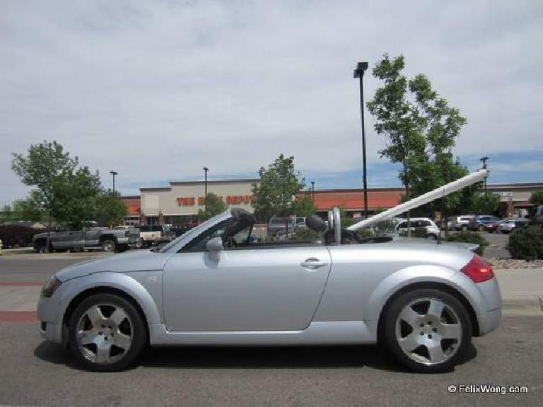 silver 2001 Audi TT Roadster carrying PVC pipe, Home Depot