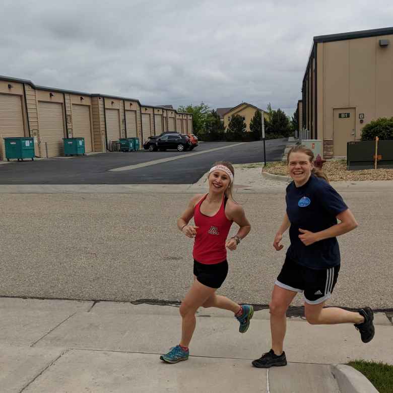 Emily and Evelyn finishing the initial 1-mile run.