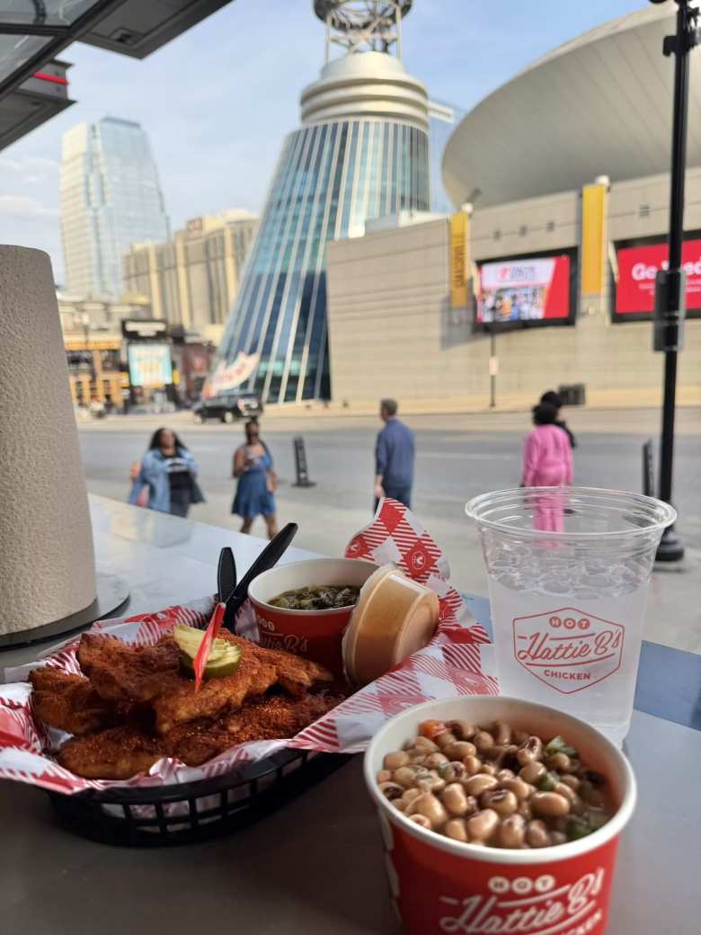 A Grilled 3 Tenders Plate with Black Eyed Peas Salad, Southern Collard Greens, and Nashville Comeback Sauce from Hattie B's Hot Chicken.