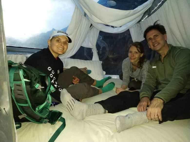 Mel, Teresa, and Matthew in the sleeping area of the pod.