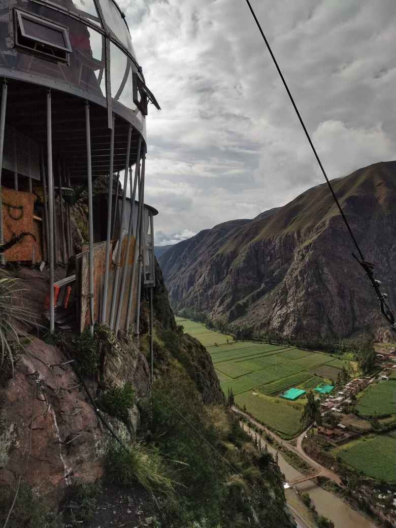The stilts holding up the dining pod, with the Sacred Valley below.