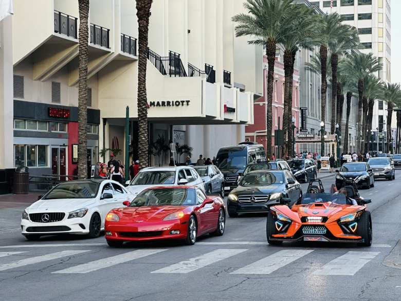 A red C6 Corvette and an orange 