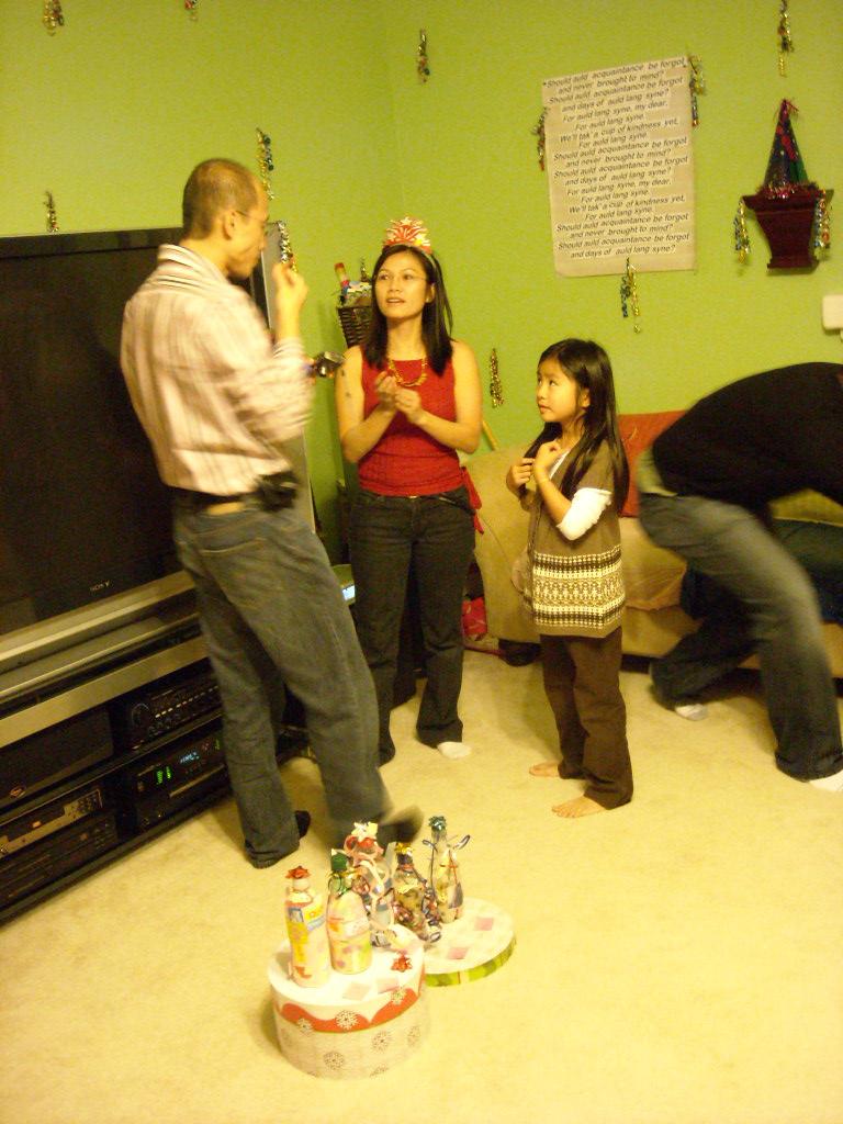 Thai and Susan talking while a kid hopes she won the "best decorated bottle" contest.