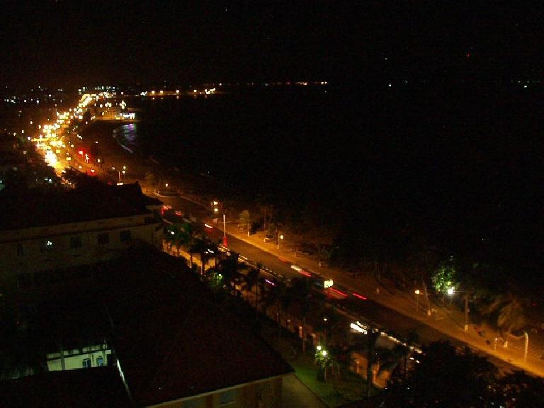 Nighttime view of Nha Trang from the balcony of our room across from the beach.