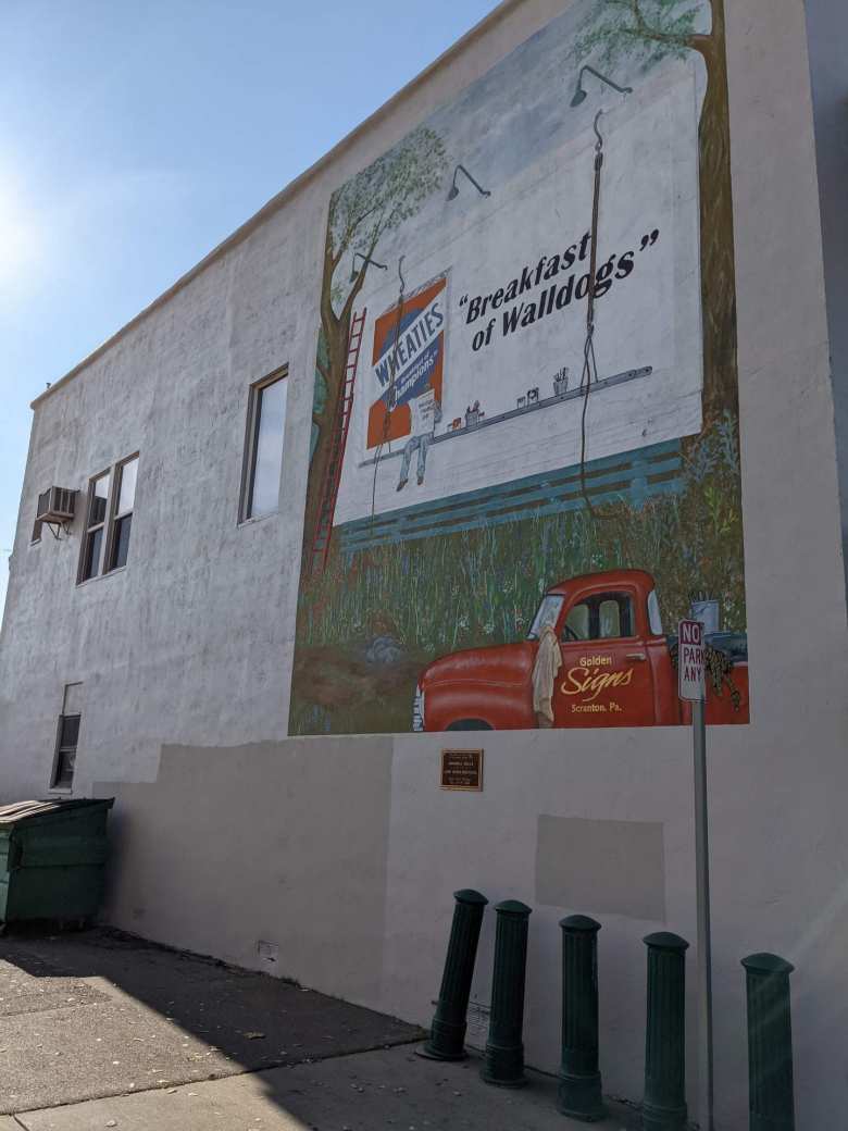 A mural that says "Wheaties: Breakfast of Walldogs" in Lodi, California.