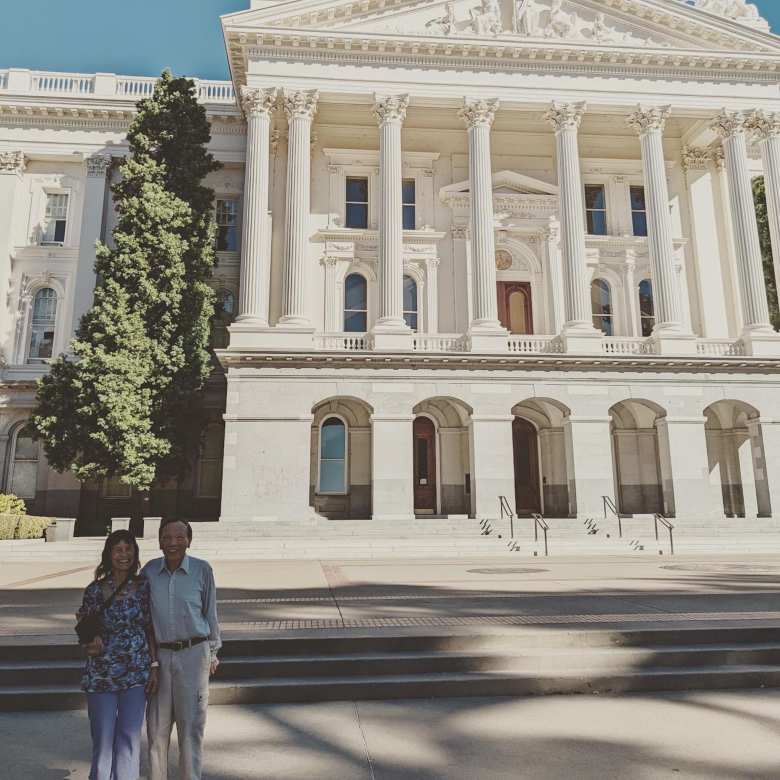 My mom and dad in front of the state capital in Sacramento, California.