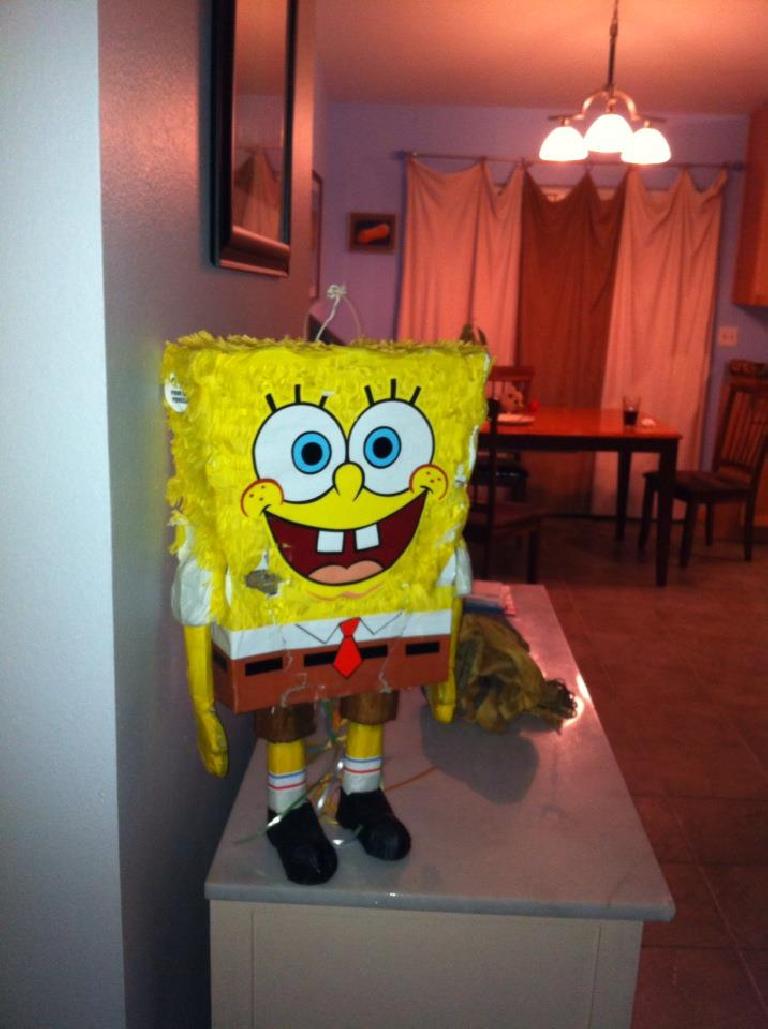 SpongeBob greets Alene when she gets back from Arizona. Her husband had relieved him of his motorist greeter duties.