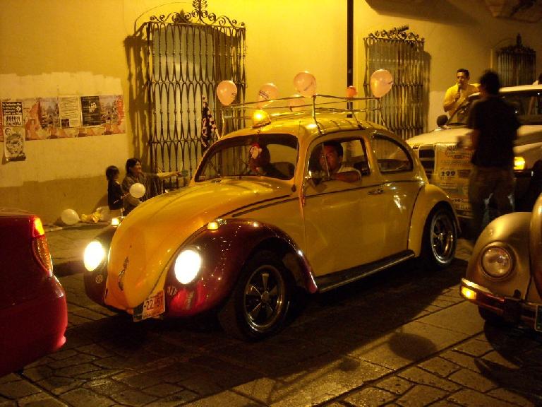 A pimped-out Volkswagen Beetle in a parade near the Z