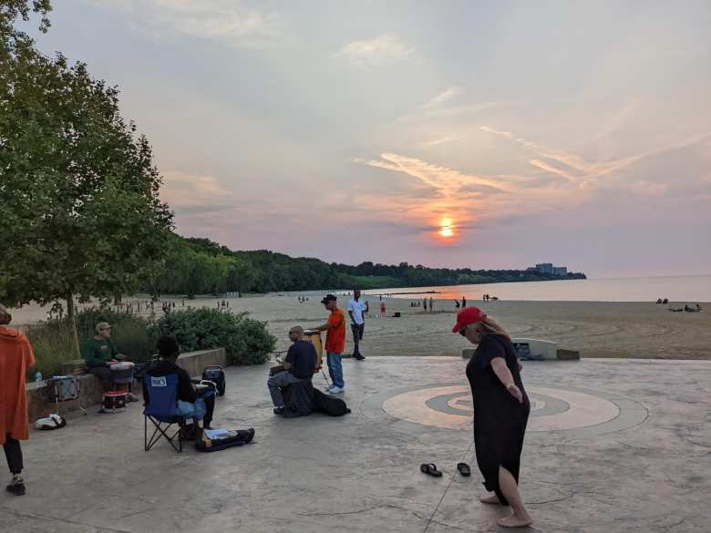 Musicians at Edgewater Park with a sunset in the background.