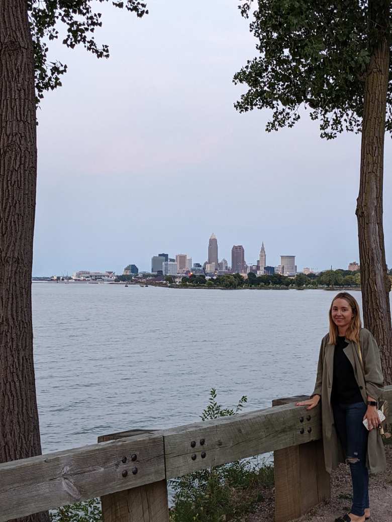 Andrea at Edgewater Park with downtown Cleveland in the background.