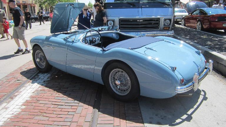baby blue Austin-Healey 100 with folded windshield