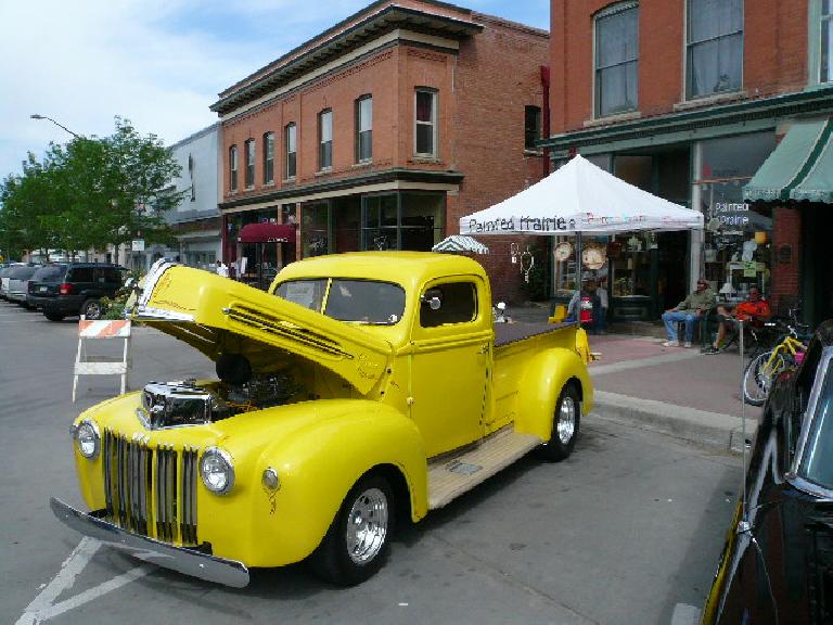 A yellow pickup truck -- a Dodge, I think.