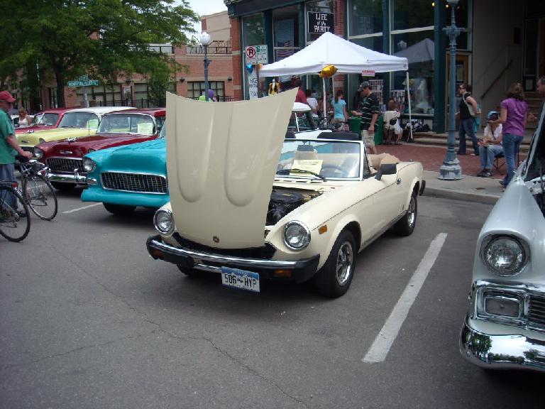 The only Italian car at the car show: a Fiat Spider.  I remember seeing (and admiring) these a lot growing up in the 80s.