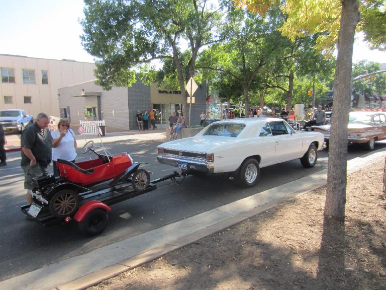 A Chevrolet Chevelle towing a pedal car.