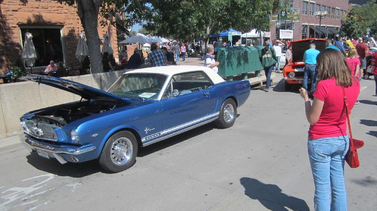 Maureen texting her mom about whether she had a Mustang like this '65. Turns out her mom had a white '66 with a blue interior.