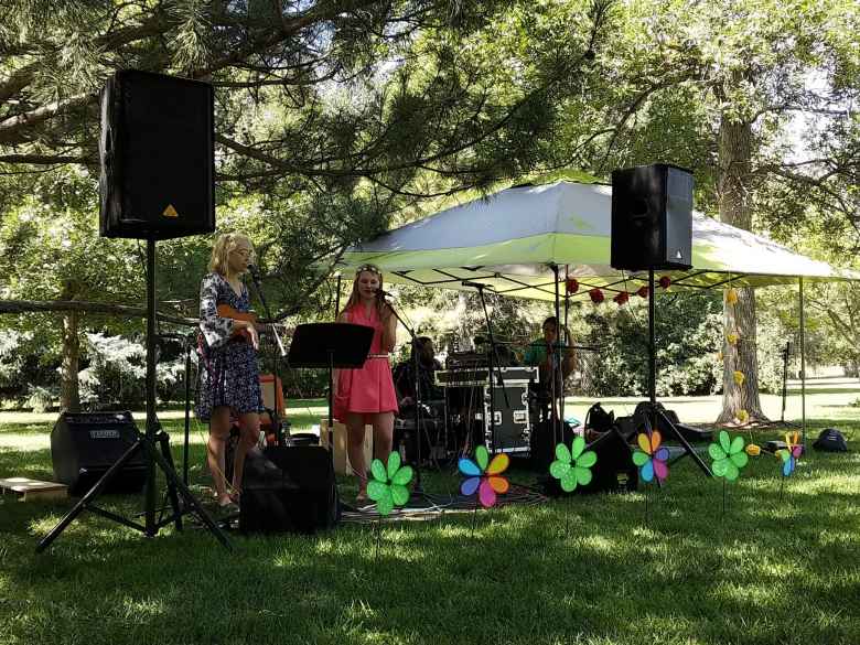 Two girls singing folk music at Rogers Park during Open Streets in Fort Collins. 