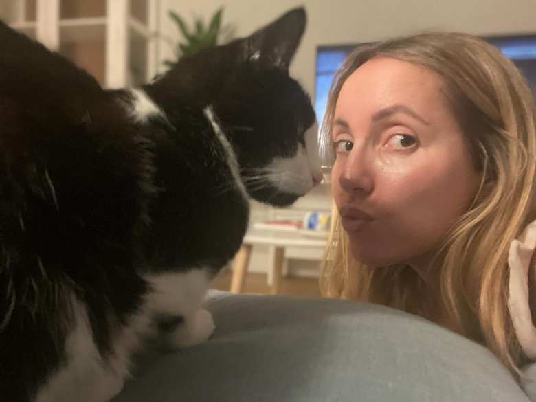 Oreo giving Andrea a nose boop. Oreo giving Andrea a nose boop.