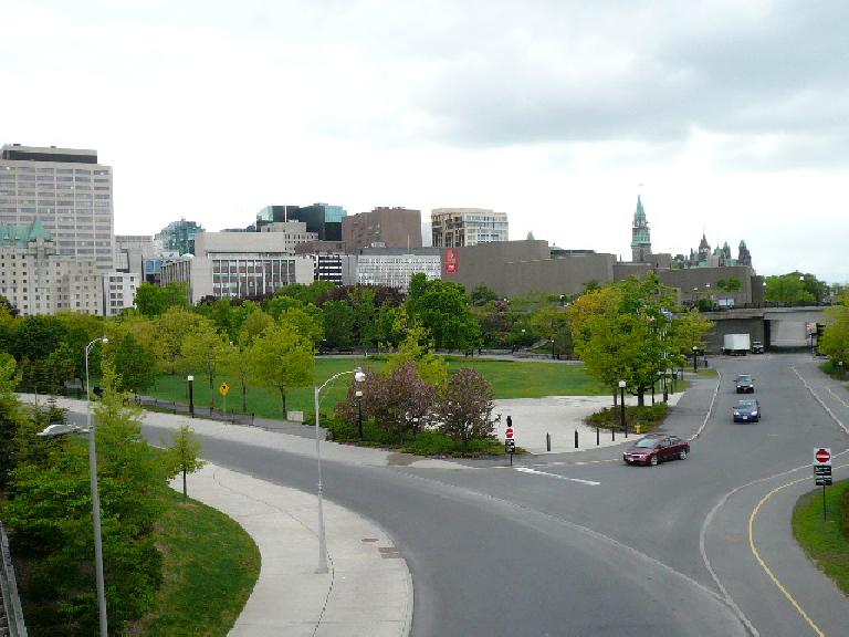 Y-shaped road with medium-height modern buildings in the background in Ottawa