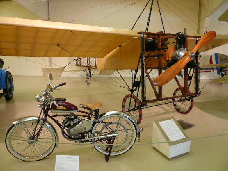 The 1946 Whizzer Motorbike got 125 mpg with 2.5 hp.  Louis Bleriot and his 1909 Bleriot XI made the first aeroplane flight across the English Channel.